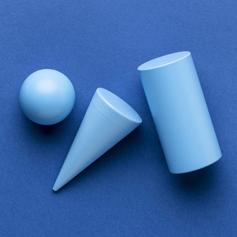 Cilindro de teste de peças pequenas ao lado de blocos de montar de kits para crianças
